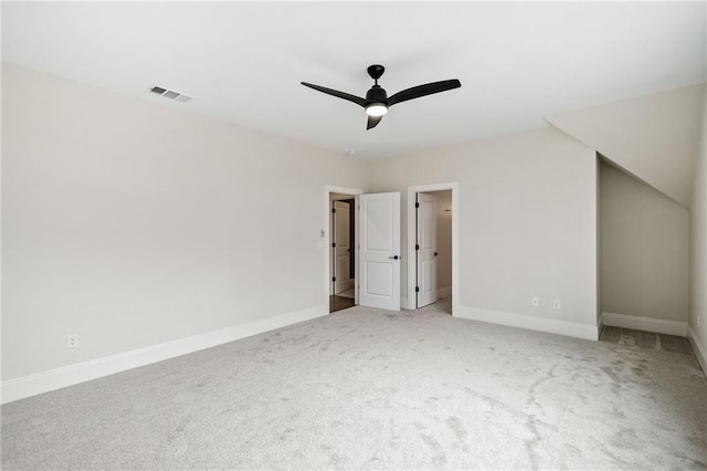 unfurnished bedroom featuring ceiling fan, baseboards, visible vents, and carpet