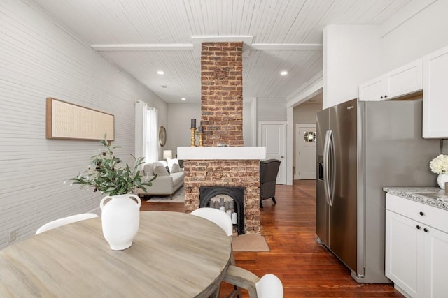 dining room with wood ceiling, dark wood finished floors, and recessed lighting