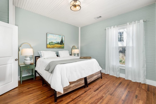 bedroom featuring wood finished floors