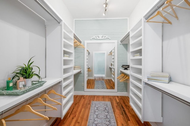 spacious closet featuring wood finished floors