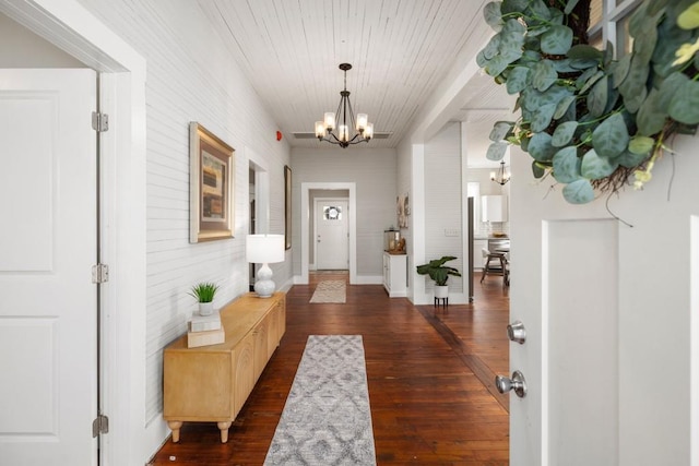 entrance foyer featuring a chandelier and dark wood-style floors