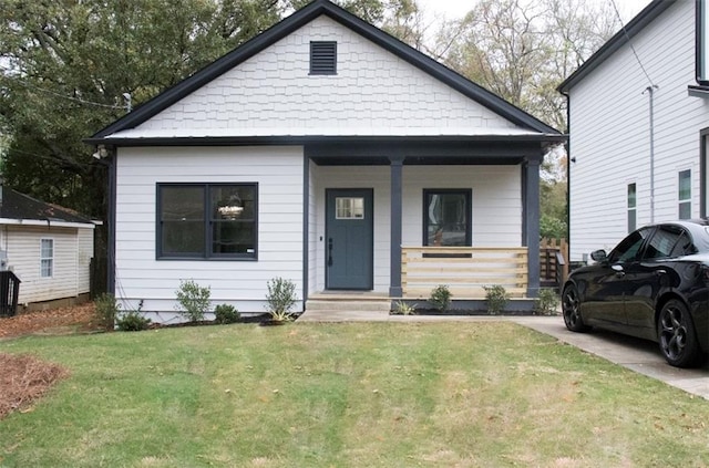 bungalow-style house featuring a porch and a front lawn