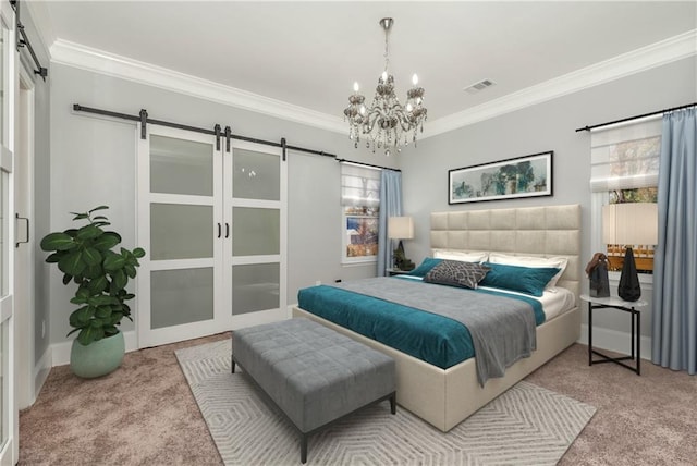 carpeted bedroom featuring ornamental molding, an inviting chandelier, and a barn door