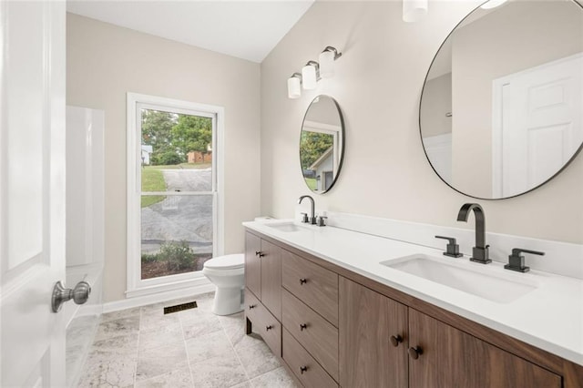 bathroom with vanity and toilet