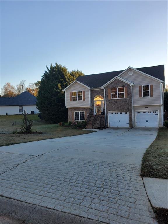 split foyer home featuring a garage