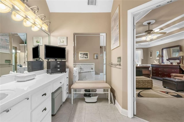 580 River Valley Dr, Dacula, GA 30019 - bathroom featuring a ceiling fan, tile patterned flooring, vanity, crown molding, and baseboards