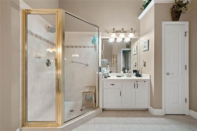 580 River Valley Dr, Dacula, GA 30019 - bathroom featuring tile patterned floors, a shower stall, and vanity