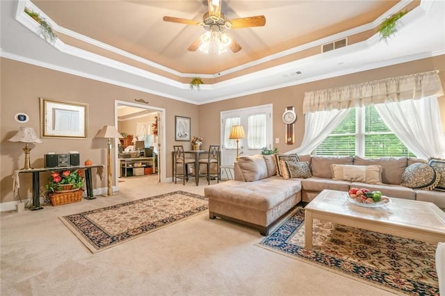 580 River Valley Dr, Dacula, GA 30019 - living area with a raised ceiling, carpet flooring, a ceiling fan, ornamental molding, and baseboards