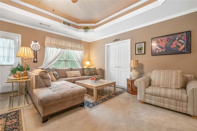580 River Valley Dr, Dacula, GA 30019 - living area featuring carpet flooring, a tray ceiling, ornamental molding, and a ceiling fan