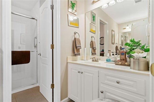 580 River Valley Dr, Dacula, GA 30019 - full bath featuring vanity, a shower stall, and tile patterned flooring