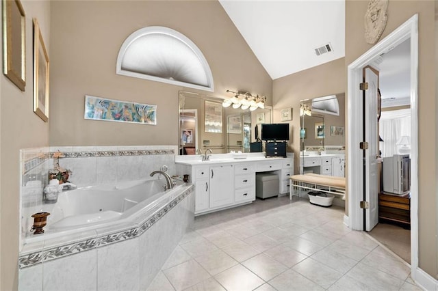 580 River Valley Dr, Dacula, GA 30019 - full bath featuring a whirlpool tub, vanity, tile patterned flooring, and high vaulted ceiling