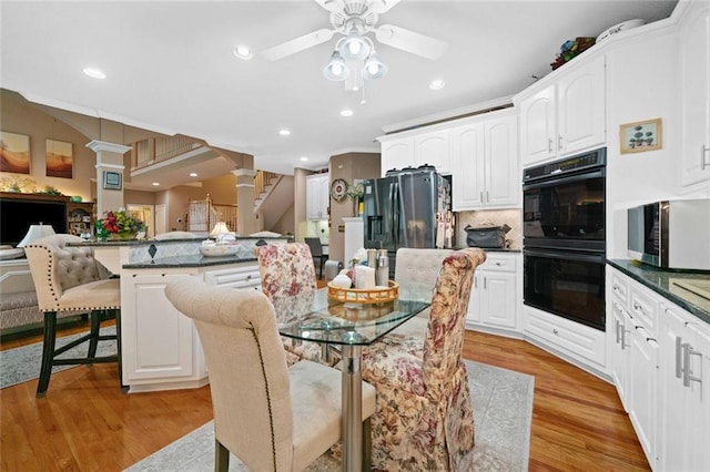 580 River Valley Dr, Dacula, GA 30019 - dining area featuring ornate columns, ceiling fan, recessed lighting, and light wood finished floors