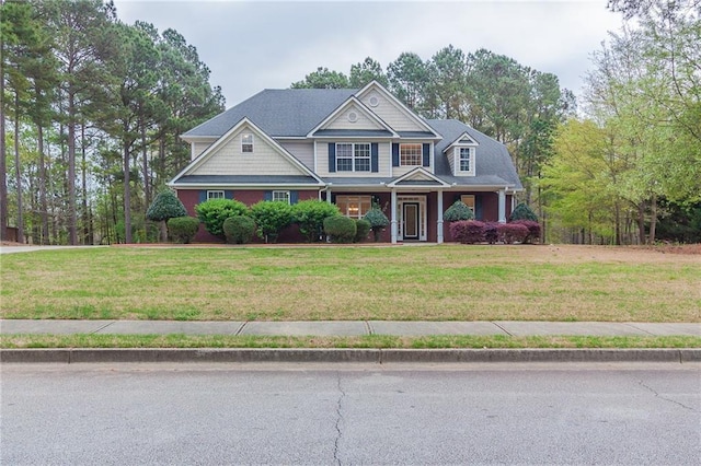 craftsman house featuring a front lawn