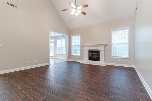 unfurnished living room featuring high vaulted ceiling and ceiling fan