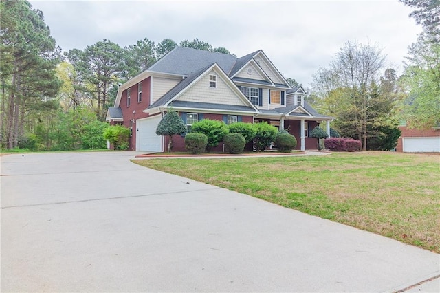 view of front of home featuring a front yard and a garage