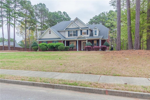 craftsman-style home with a front yard