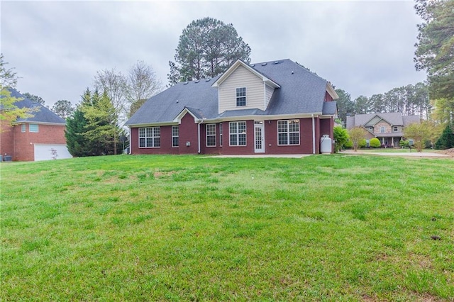 back of house featuring a yard