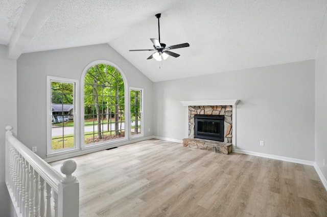 unfurnished living room with baseboards, ceiling fan, wood finished floors, and lofted ceiling