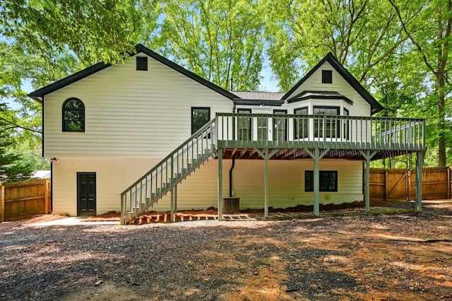 back of property featuring central AC unit, stairway, fence, and a deck