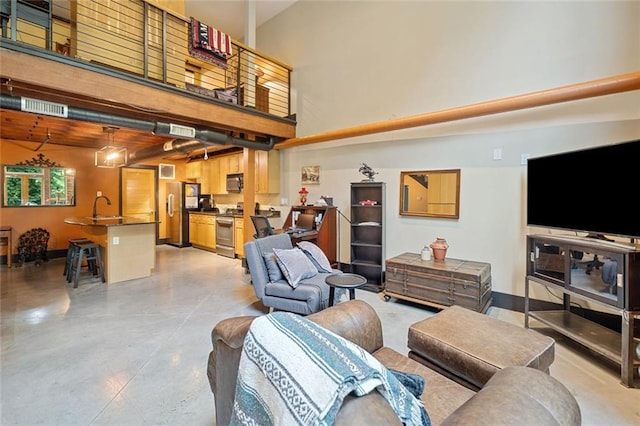 319 Atlanta St SE Unit 315, Marietta, GA 30060 - living room with a high ceiling and finished concrete floors