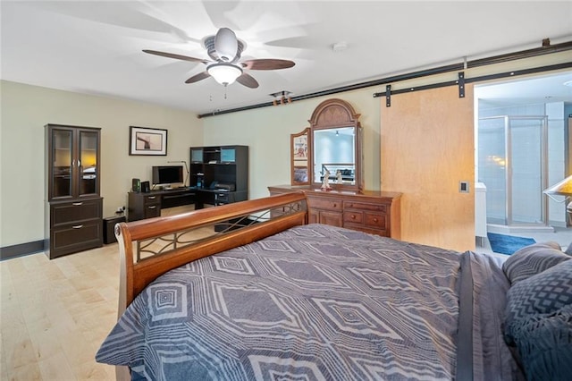 319 Atlanta St SE Unit 315, Marietta, GA 30060 - bedroom featuring a barn door, a desk, and a ceiling fan