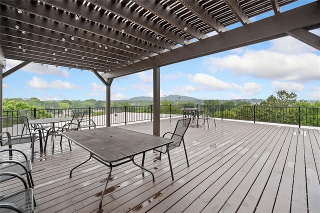 319 Atlanta St SE Unit 315, Marietta, GA 30060 - wooden deck featuring outdoor dining space, a pergola, and a mountain view