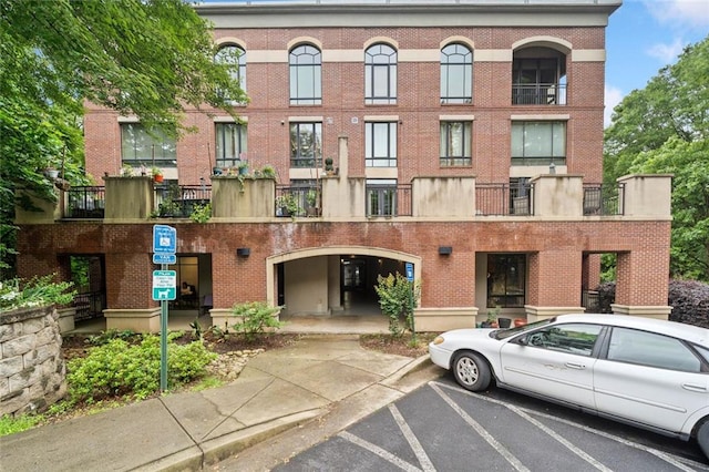 319 Atlanta St SE Unit 315, Marietta, GA 30060 - view of building exterior featuring uncovered parking