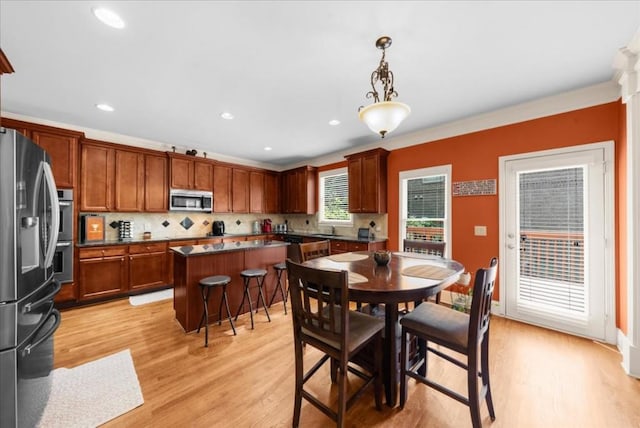 3086 Frazier Walk, Decatur, GA 30033 - dining space featuring light wood-style floors, recessed lighting, and crown molding