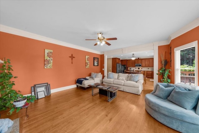 3086 Frazier Walk, Decatur, GA 30033 - living room featuring a ceiling fan, light wood-style floors, crown molding, and baseboards
