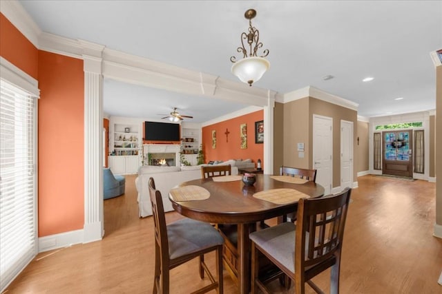 3086 Frazier Walk, Decatur, GA 30033 - dining room with a ceiling fan, light wood finished floors, a lit fireplace, crown molding, and baseboards