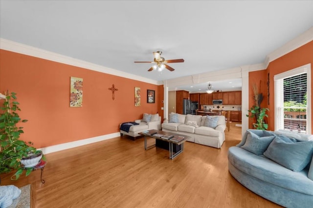 3086 Frazier Walk, Decatur, GA 30033 - living area with ceiling fan, light wood-style floors, baseboards, and crown molding