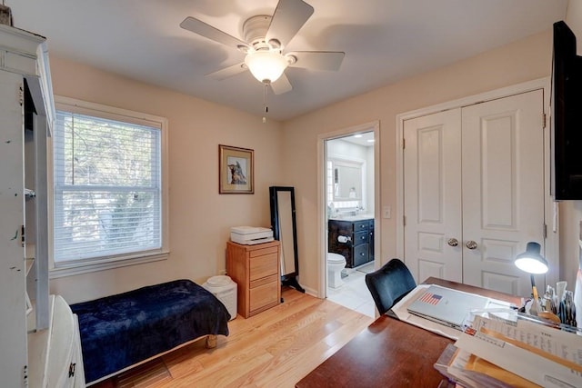 office area with ceiling fan and light hardwood / wood-style flooring