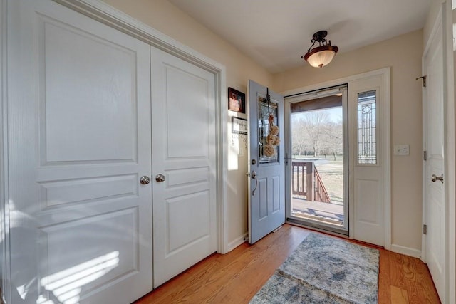 foyer with light hardwood / wood-style floors