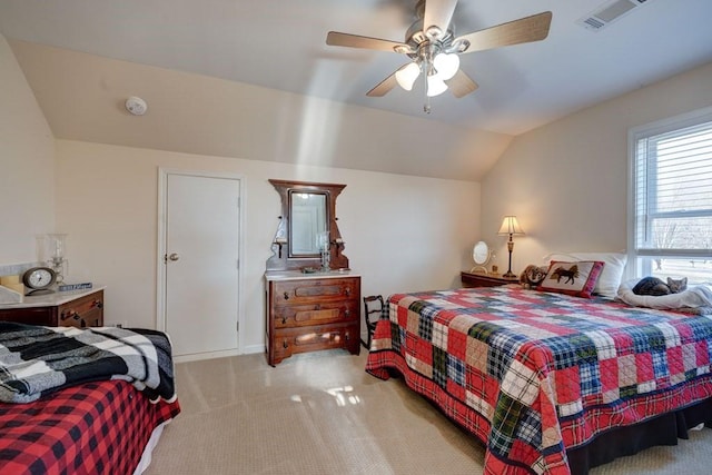 carpeted bedroom featuring lofted ceiling and ceiling fan