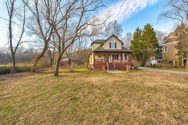 view of front of house with a porch and a front yard