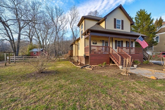 view of front of house featuring covered porch and a front yard