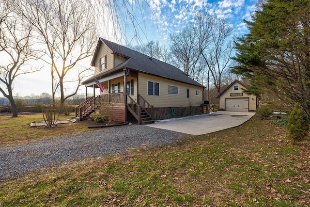 view of property exterior featuring a garage, an outbuilding, covered porch, and a lawn