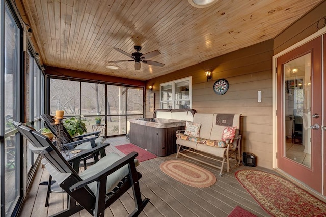 sunroom / solarium with wood ceiling and ceiling fan