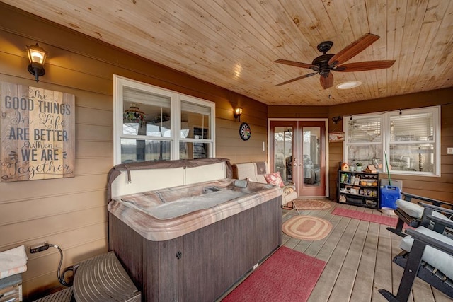 sunroom featuring ceiling fan, wood ceiling, and a jacuzzi