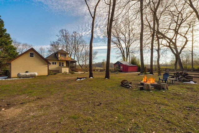 view of yard with an outdoor fire pit