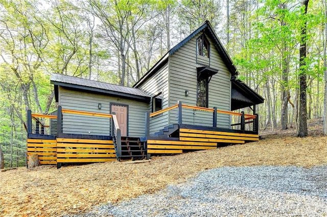 view of front of home with a wooden deck