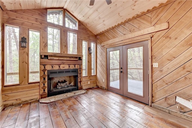 interior space featuring french doors, a healthy amount of sunlight, wooden ceiling, and lofted ceiling