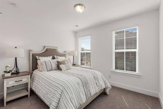 carpeted bedroom with baseboards