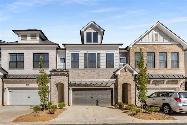 view of property featuring brick siding, an attached garage, and concrete driveway