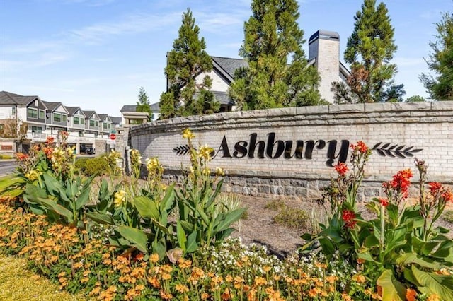 community / neighborhood sign featuring a residential view