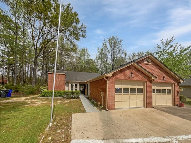 ranch-style home with brick siding, a front lawn, a garage, and driveway