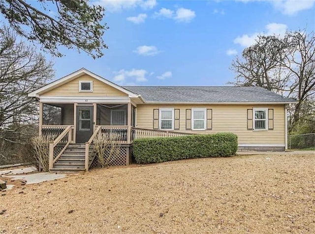 view of front of property featuring a sunroom