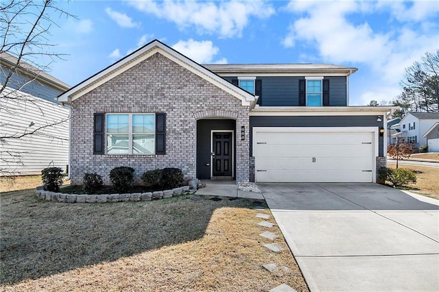 view of front of property with a garage and a front yard