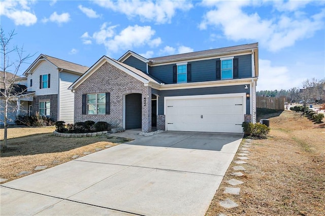 view of front of house with a garage and a front yard