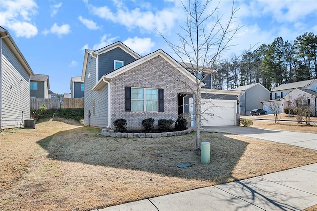 view of front facade featuring a garage, central AC, and a front lawn